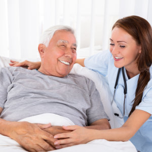 nurse and senior smiling