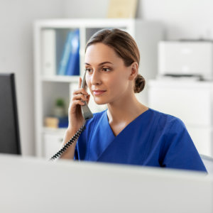 nurse calling on telephone