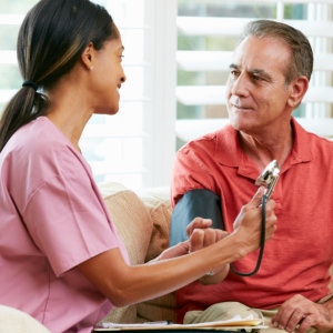 nurse checking Blood Presure on senior