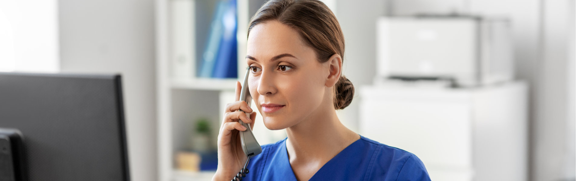 nurse calling on telephone