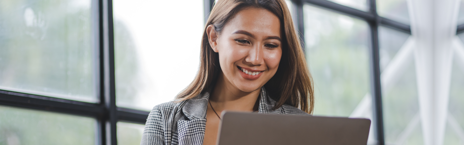 professional woman smiling while working